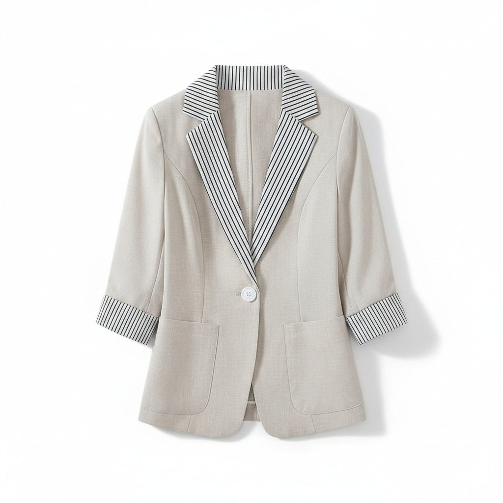 Light gray blazer with striped shirt on a beige sofa