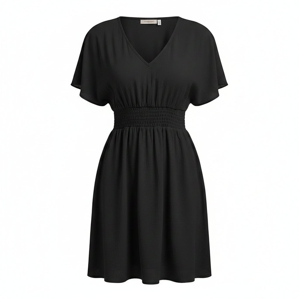 Black dress worn by a model on a white background