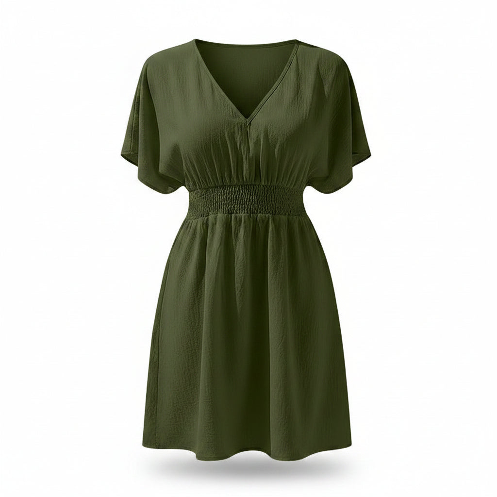 Woman wearing a green dress on a white background