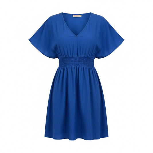Woman wearing a blue dress on a white background