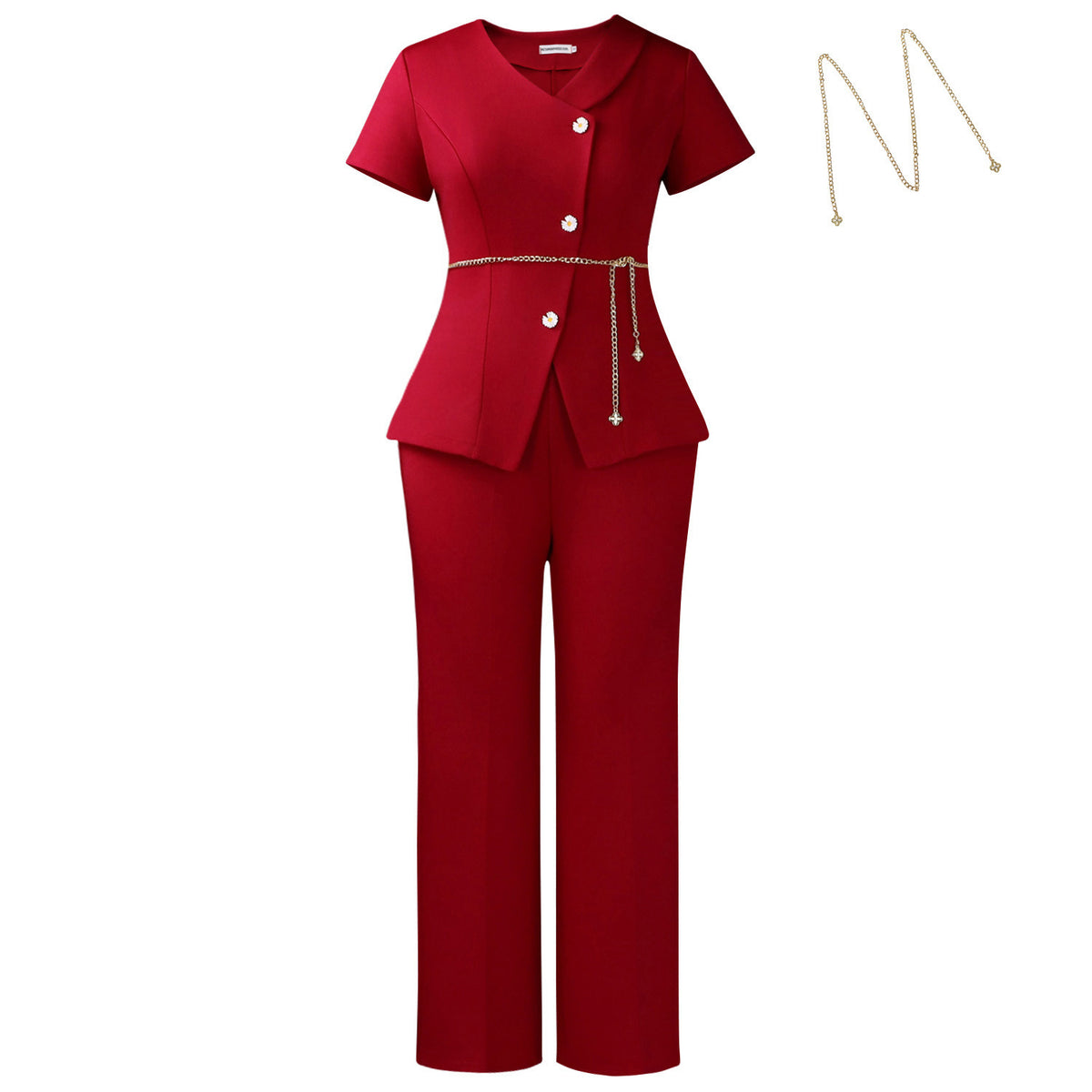 A red two-piece jumpsuit set featuring a short-sleeve peplum-style top with front buttons and a gold chain tie belt, paired with matching straight-leg pants. A gold chain necklace is shown floating to the right on a plain white background.