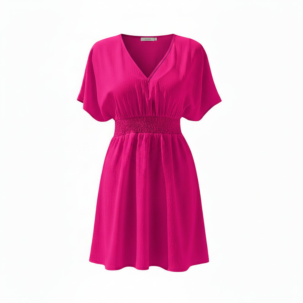Woman wearing a bright pink dress on a white background